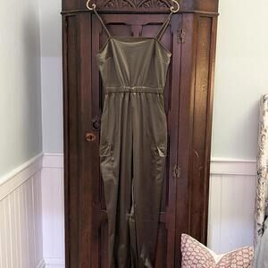 Shiny DEREK HEART green jumpsuit with adjustable straps and pockets.